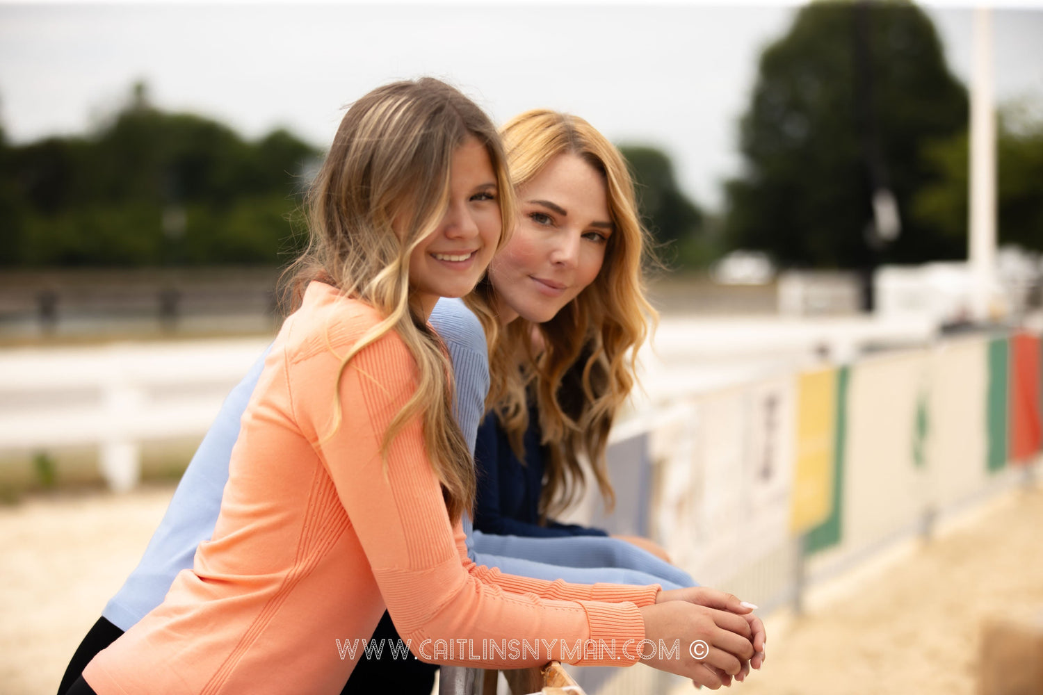 Women wearing breathable performance riding shirts for equestrian training