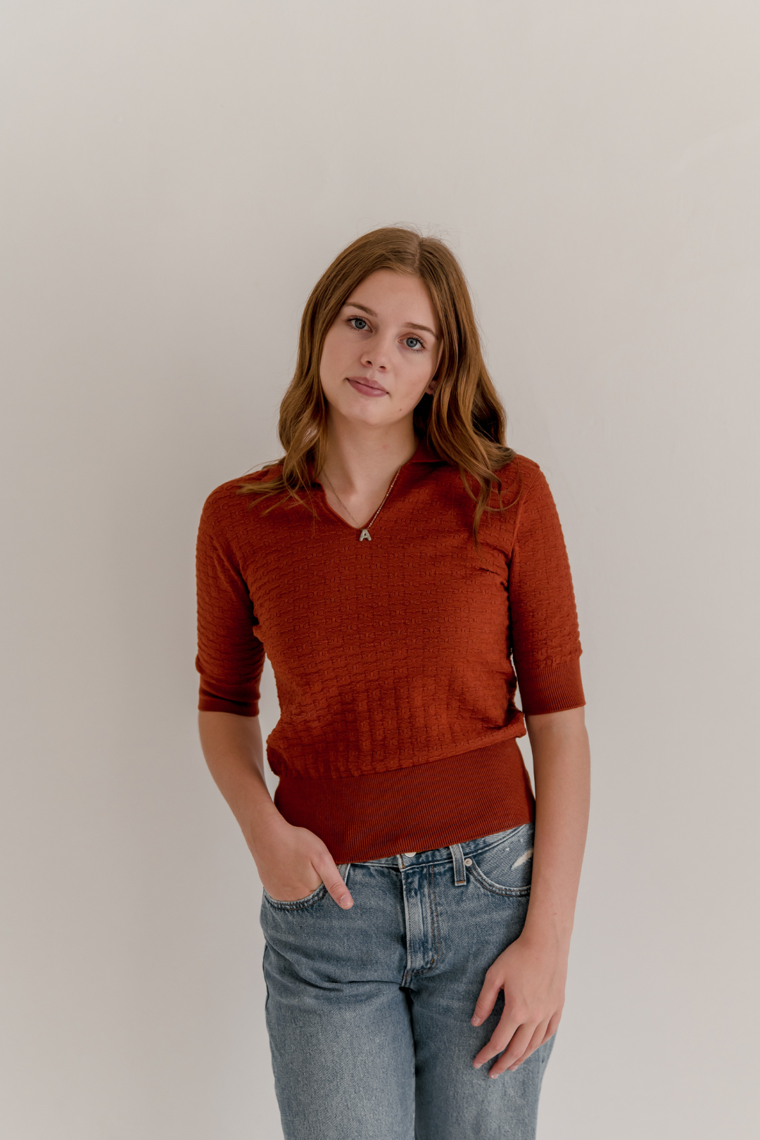 Knit polo with bit pattern in rust color